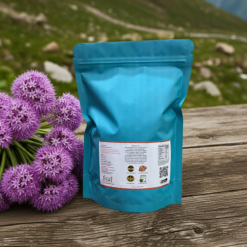 Teal package with a label next to purple flowers of kashmiri garlic on a wooden surface with a natural background