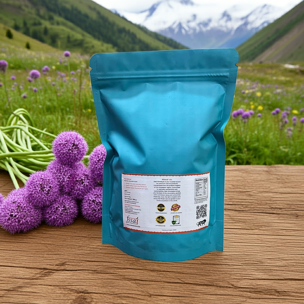 Teal package with purple flowers and green flowers of Kashmiri Garlic on a wooden surface with a mountainous background